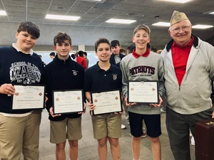 Boys smiling with veteran and awards